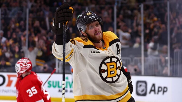 BOSTON, MASSACHUSETTS - OCTOBER 28: David Pastrnak #88 of the Boston Bruins celebrates after scoring a penalty shot awarded after he was slashed by Jake Walman #96 of the Detroit Red Wings during the third period at TD Garden on October 28, 2023 in Boston, Massachusetts. The Bruins defeat the Red Wings 4-1. (Photo by Maddie Meyer/Getty Images)